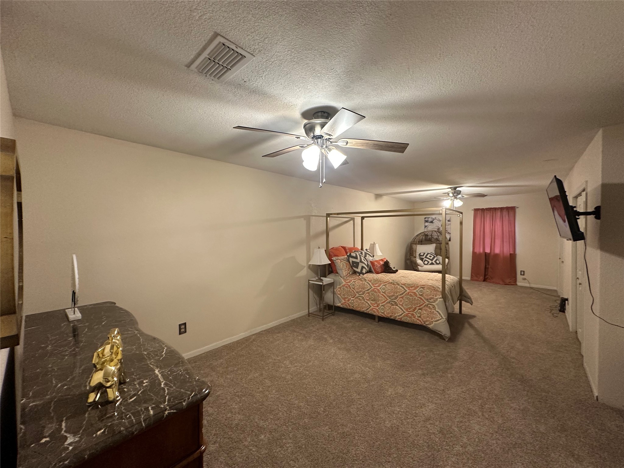 510 Ray Street Buffalo, TX 75831 - Photo 28 of 43 a bed room with furniture and a chandelier