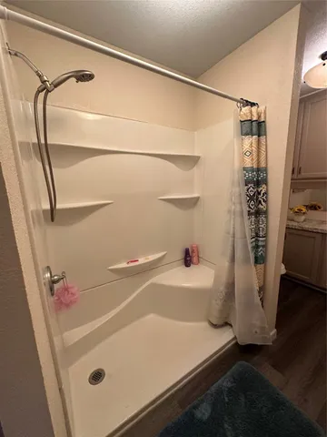 a bathroom with a toilet and a mirror