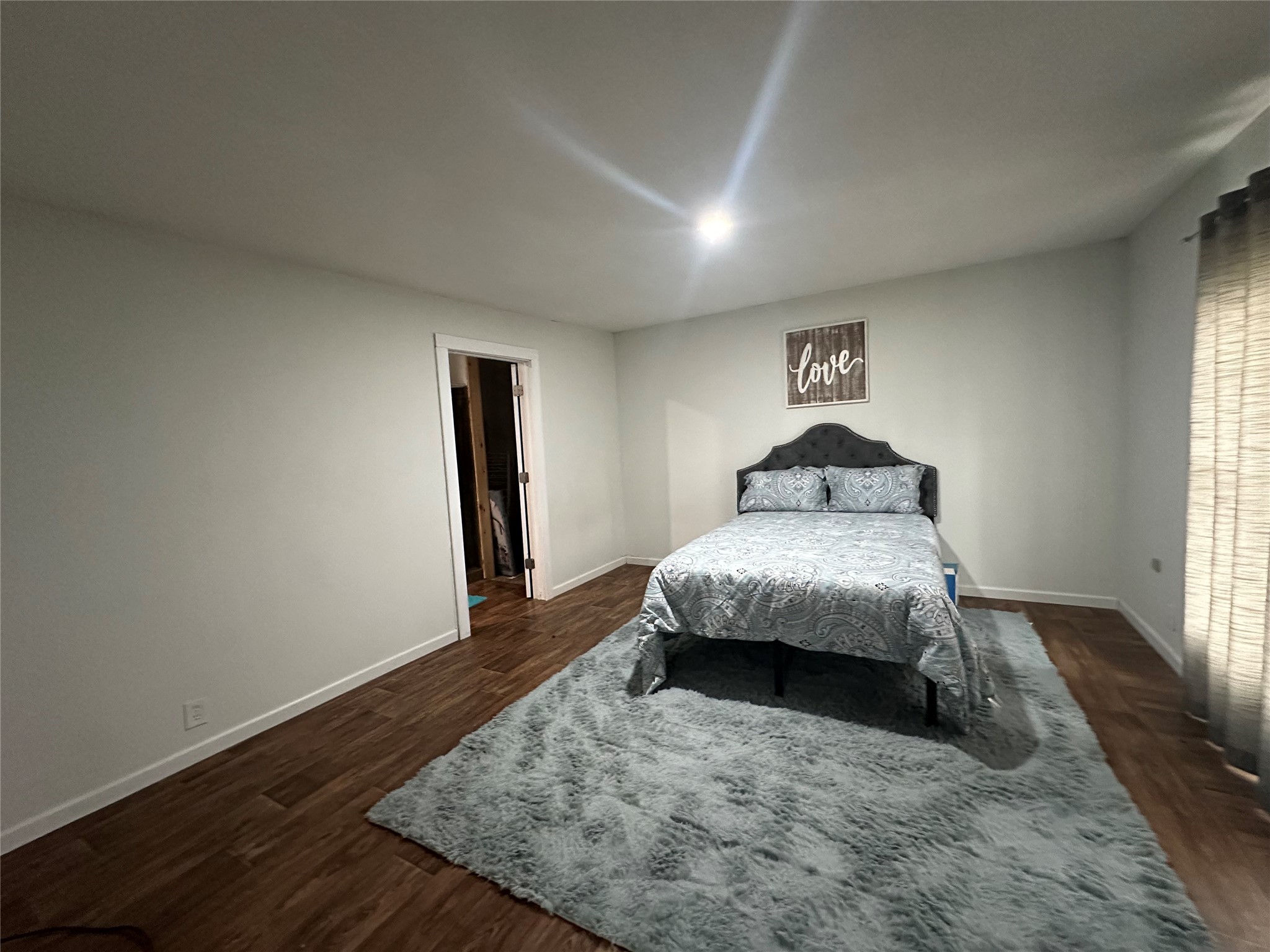 510 Ray Street Buffalo, TX 75831 - Photo 37 of 43 a bedroom with a bed and wooden floor