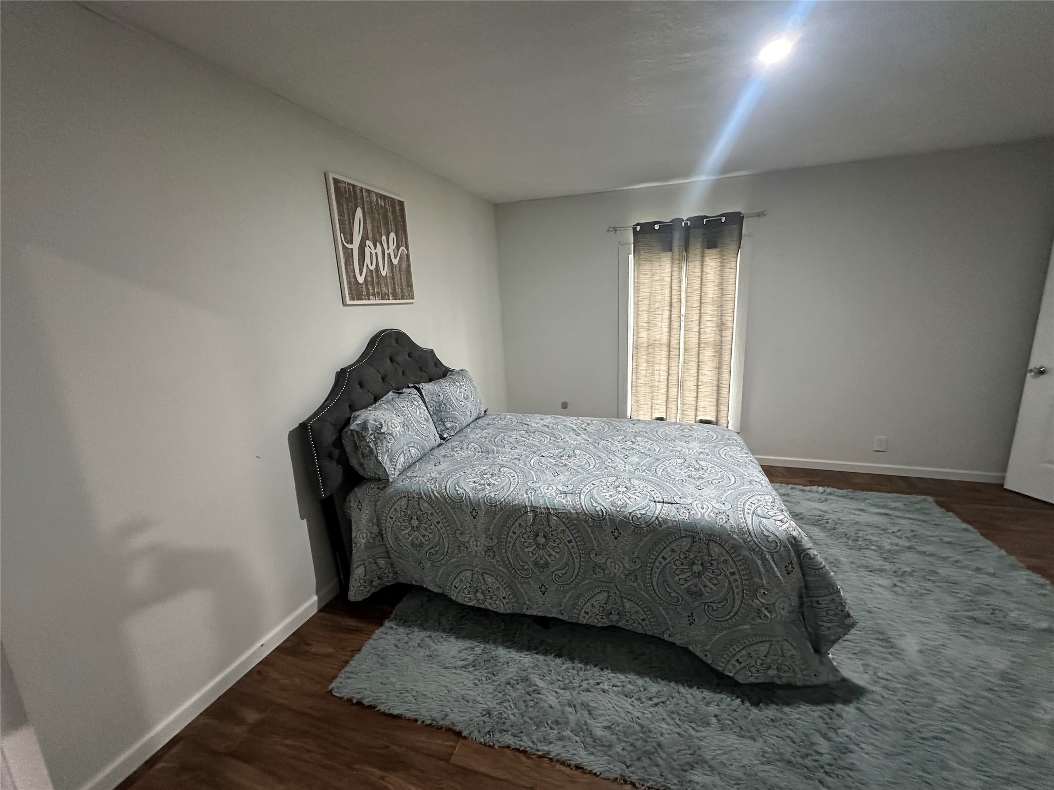 510 Ray Street Buffalo, TX 75831 - Photo 40 of 43 a bed sitting in a bedroom next to a window