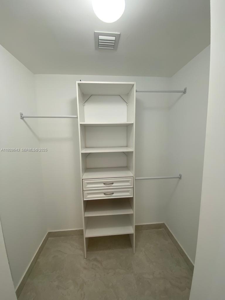 488 Northeast 18th Street, Unit 1804 Miami, FL 33132 - Photo 12 of 42 a view of an empty walk in closet