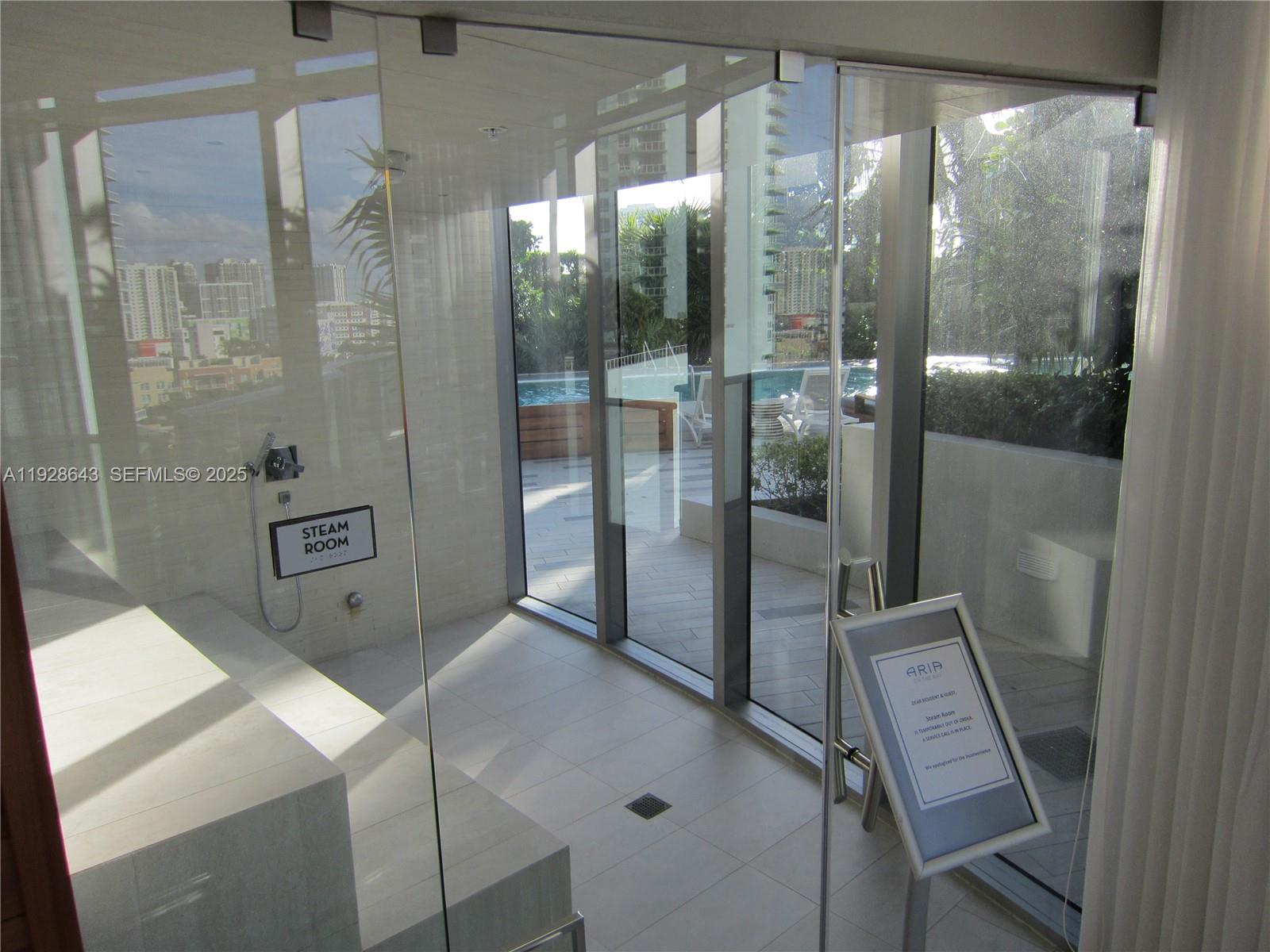 488 Northeast 18th Street, Unit 1804 Miami, FL 33132 - Photo 30 of 42 a bathroom with a shower