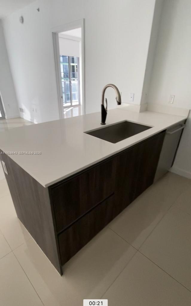 488 Northeast 18th Street, Unit 1804 Miami, FL 33132 - Photo 7 of 42 a close view of a sink and a dishwasher in a room