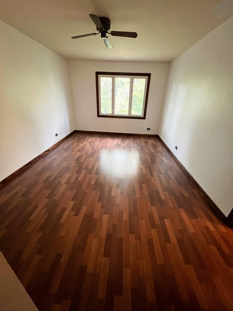 7749 West Harbor Court Frankfort, IL 60423 - Photo 15 of 17 wooden floor in an empty room with a window