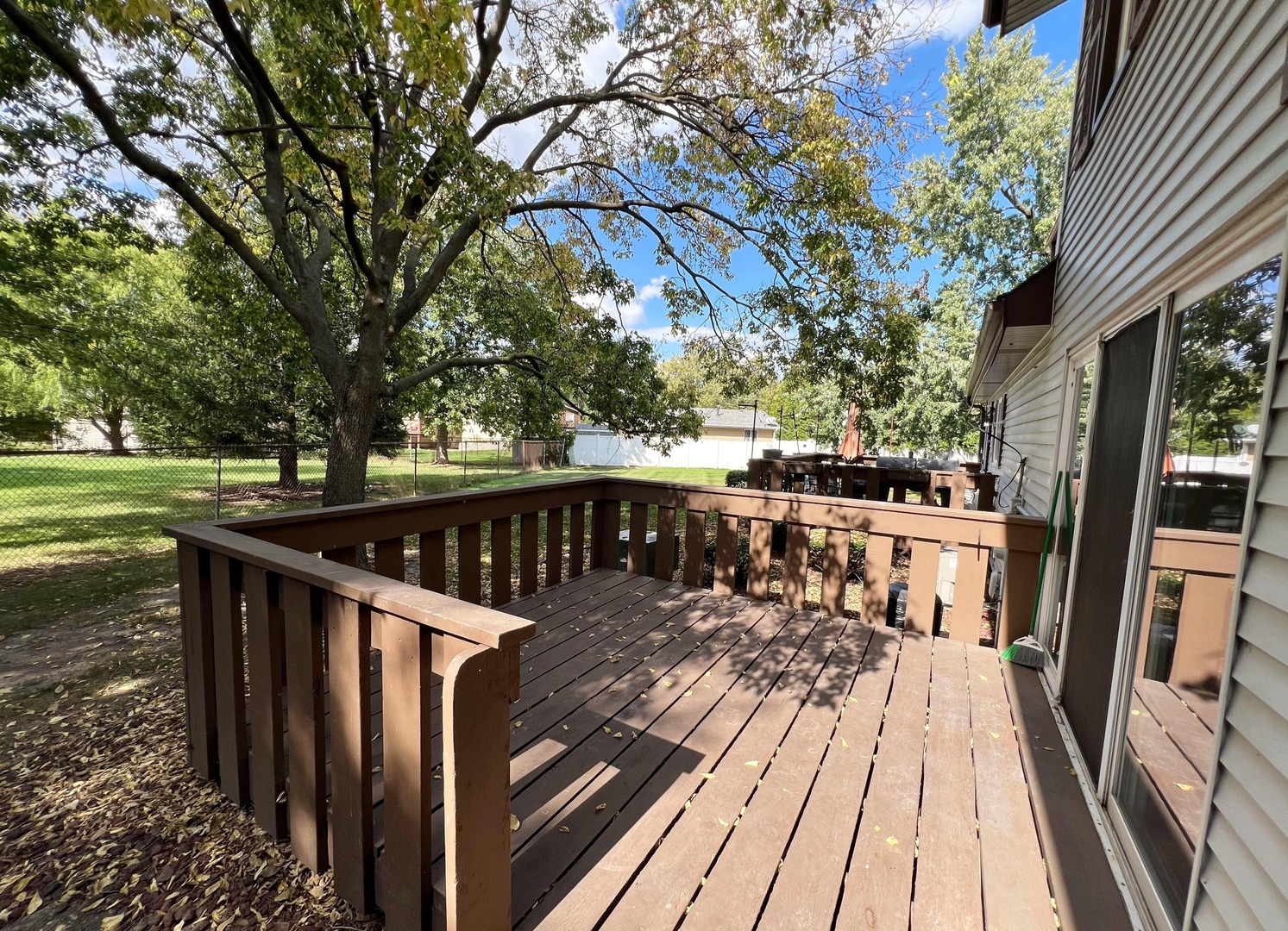 7749 West Harbor Court Frankfort, IL 60423 - Photo 4 of 17 a view of balcony with wooden floor and fence