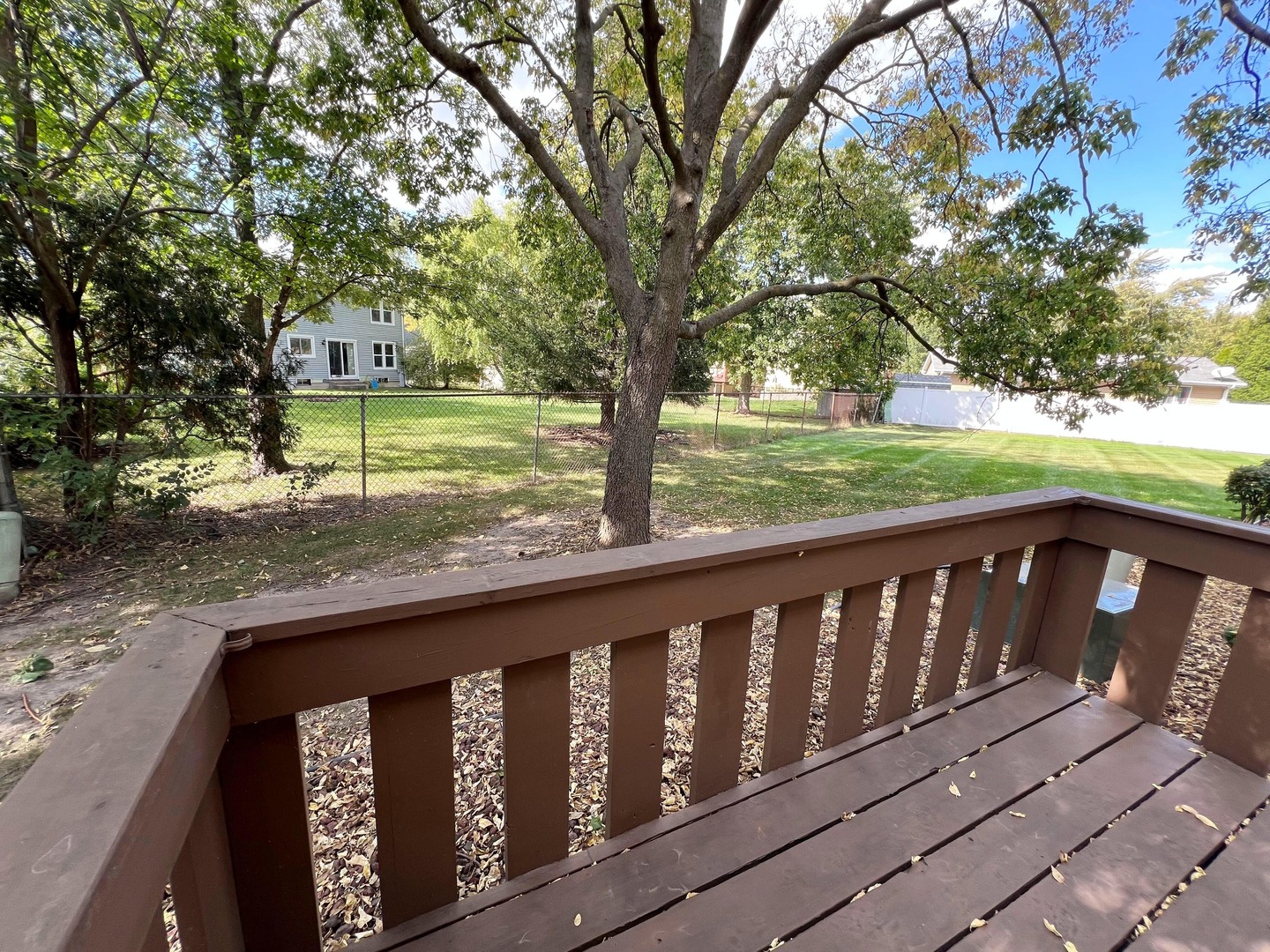 7749 West Harbor Court Frankfort, IL 60423 - Photo 5 of 17 a view of a wooden deck next to a yard
