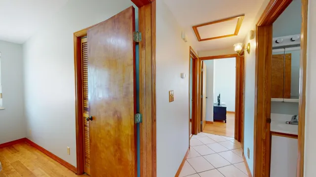 a bedroom with a bed and a lamp