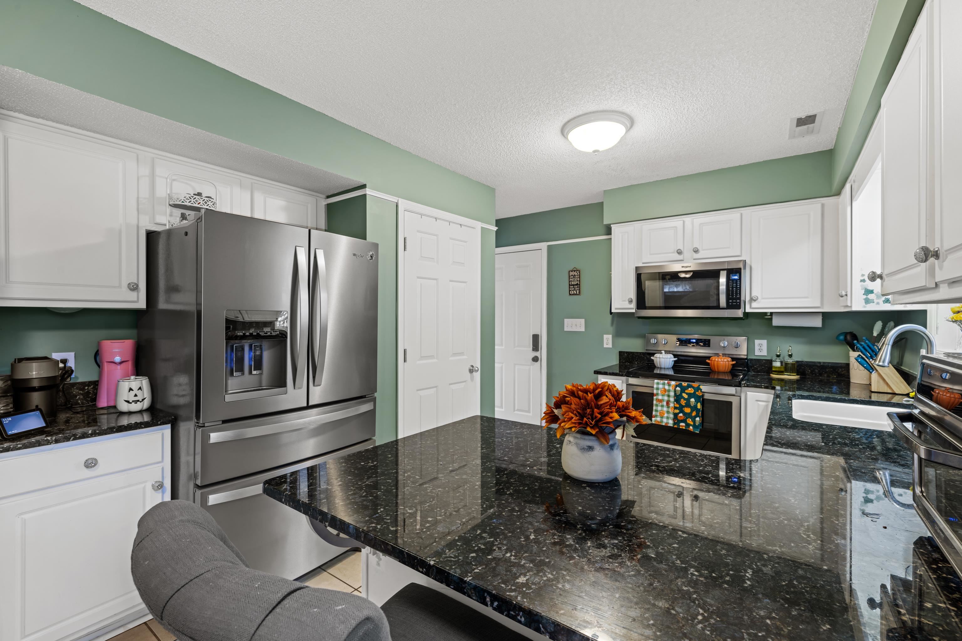 48 Meadow Ridge Road Waynesboro, VA 22980 - Photo 23 of 71 a kitchen with stainless steel appliances granite countertop a refrigerator sink and stove