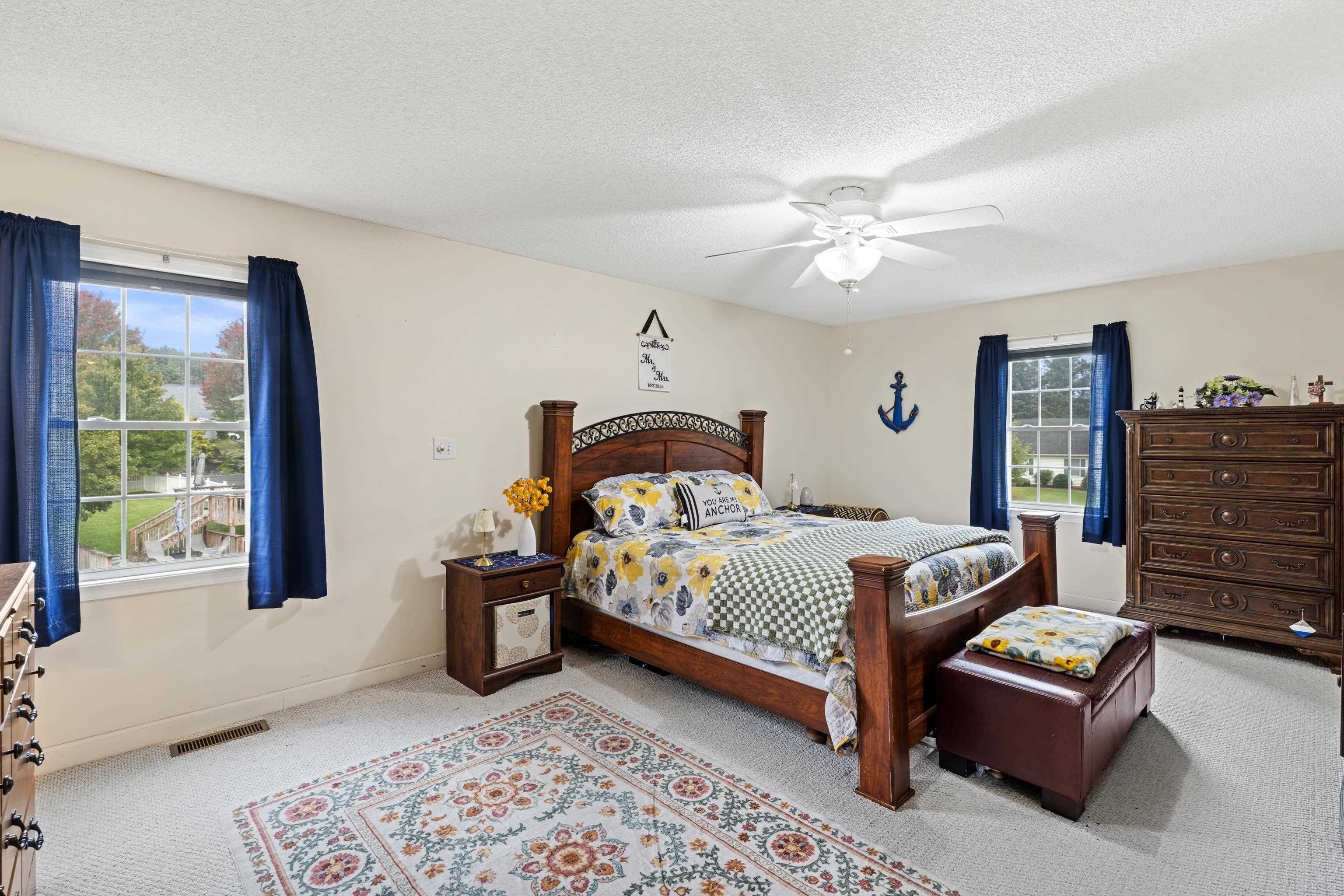 48 Meadow Ridge Road Waynesboro, VA 22980 - Photo 31 of 71 a bedroom with a bed and a chandelier