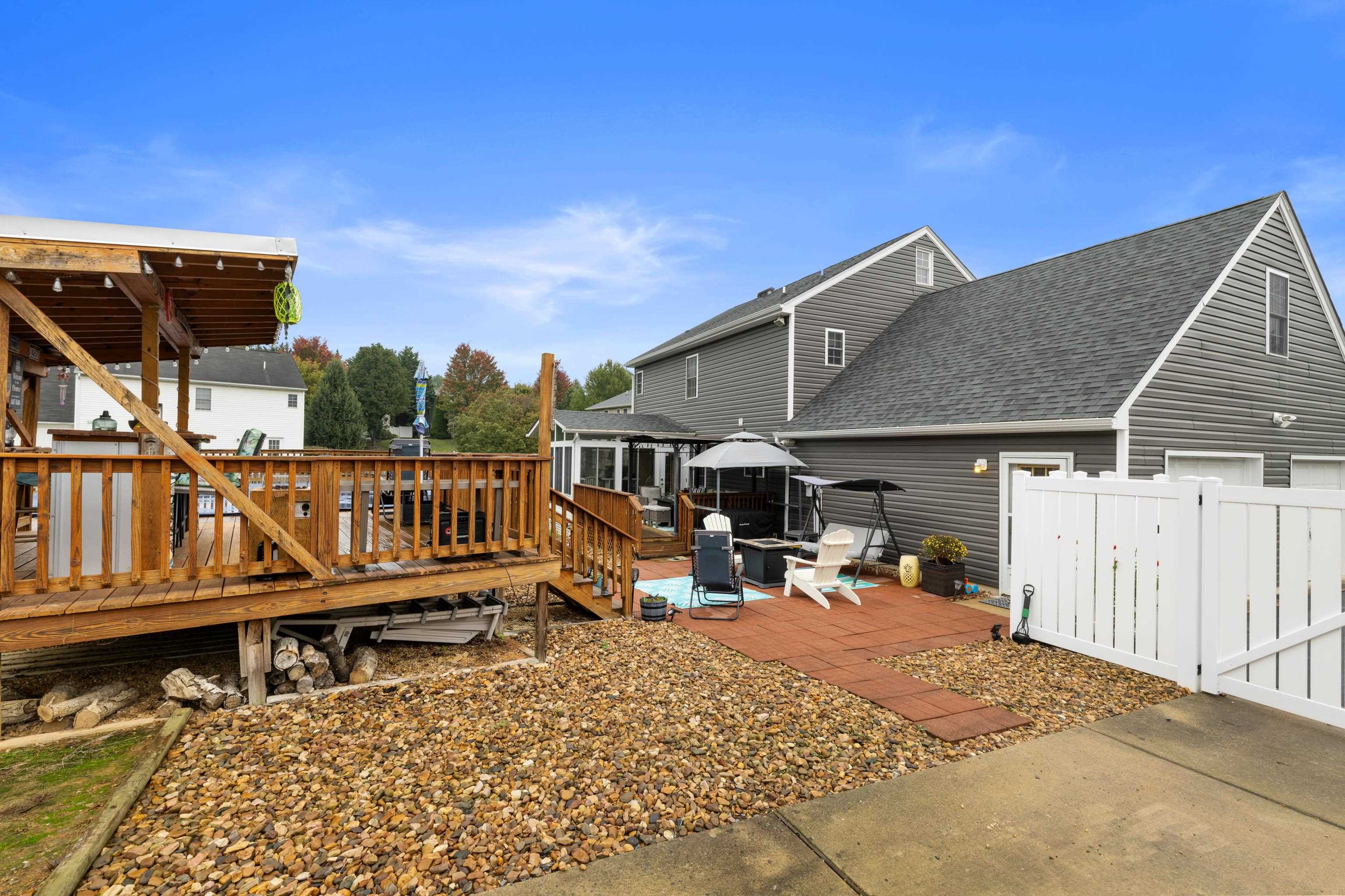 48 Meadow Ridge Road Waynesboro, VA 22980 - Photo 50 of 71 a view of a house with wooden deck and furniture