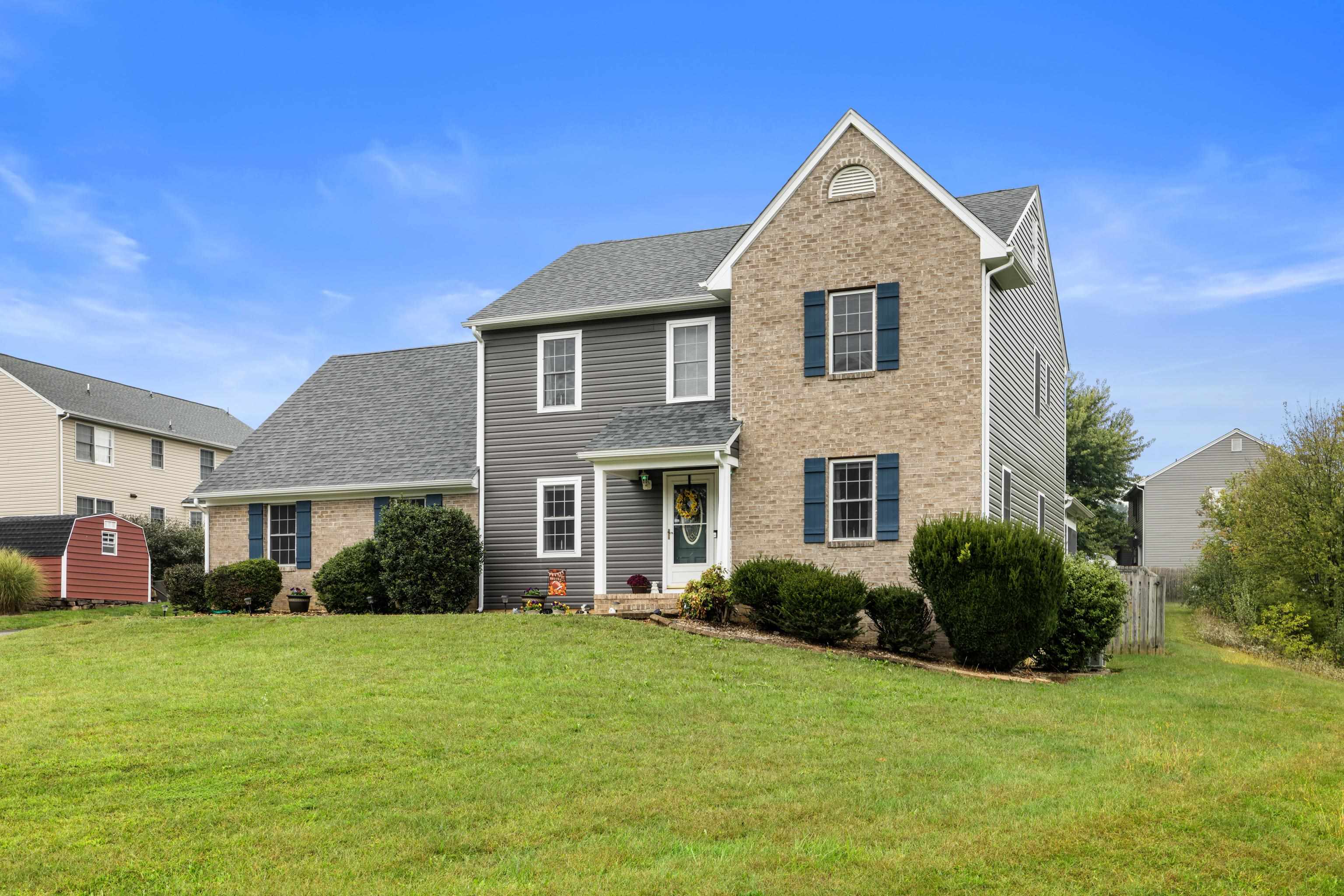 48 Meadow Ridge Road Waynesboro, VA 22980 - Photo 5 of 71 a front view of a house with a garden