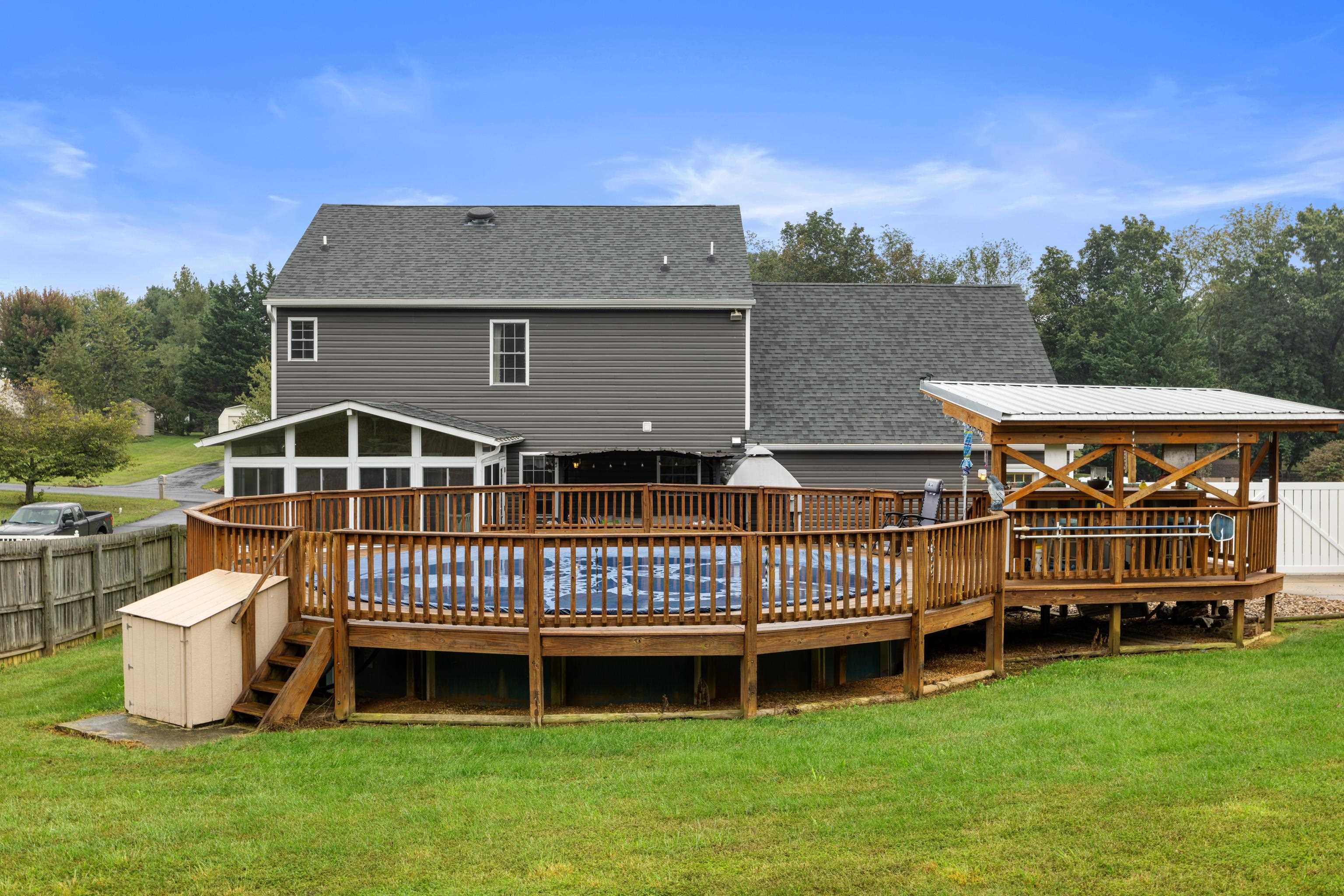 48 Meadow Ridge Road Waynesboro, VA 22980 - Photo 59 of 71 a front view of a house with a yard table and chairs