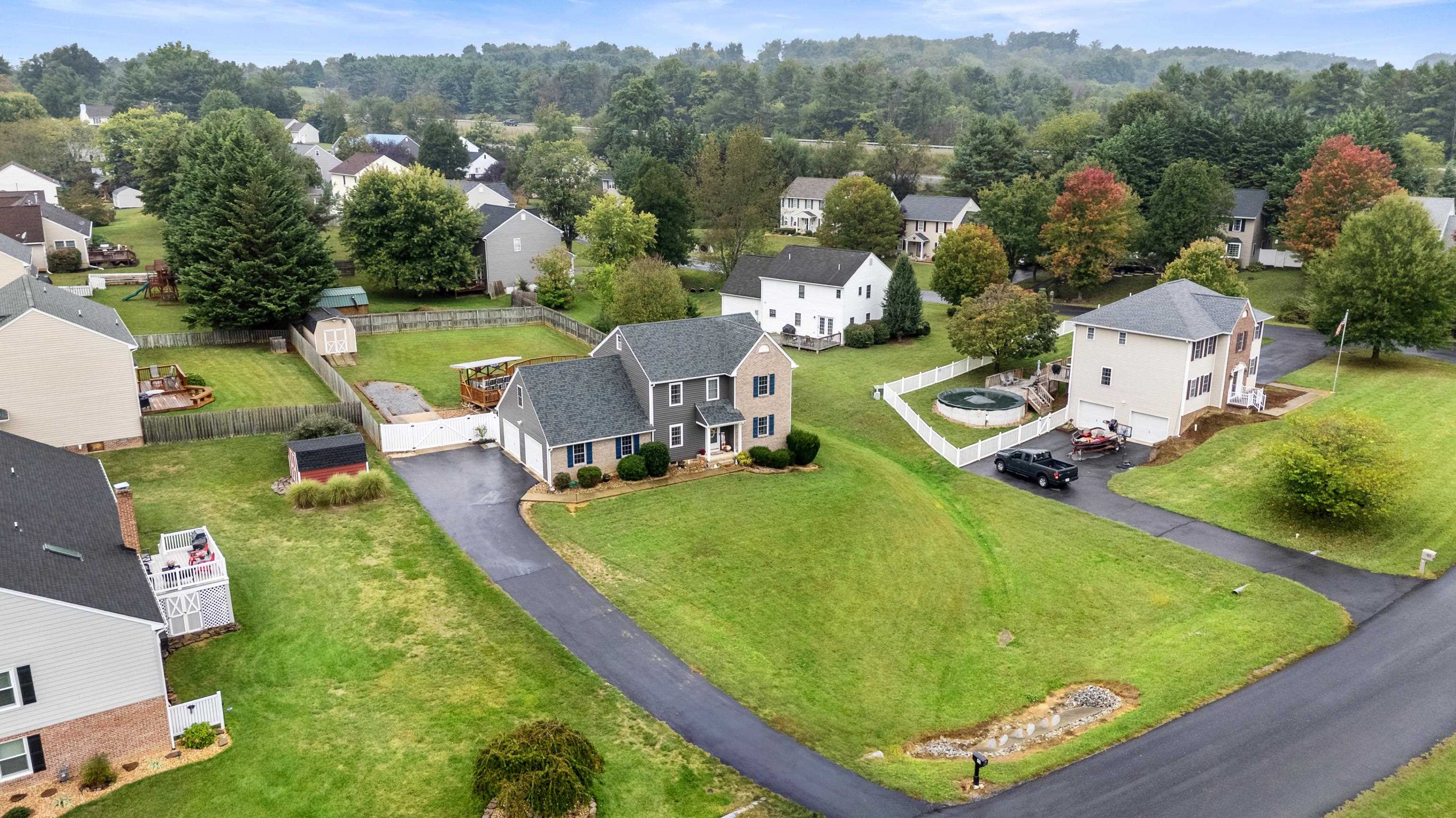 48 Meadow Ridge Road Waynesboro, VA 22980 - Photo 66 of 71 an aerial view of a house with a garden and swimming pool