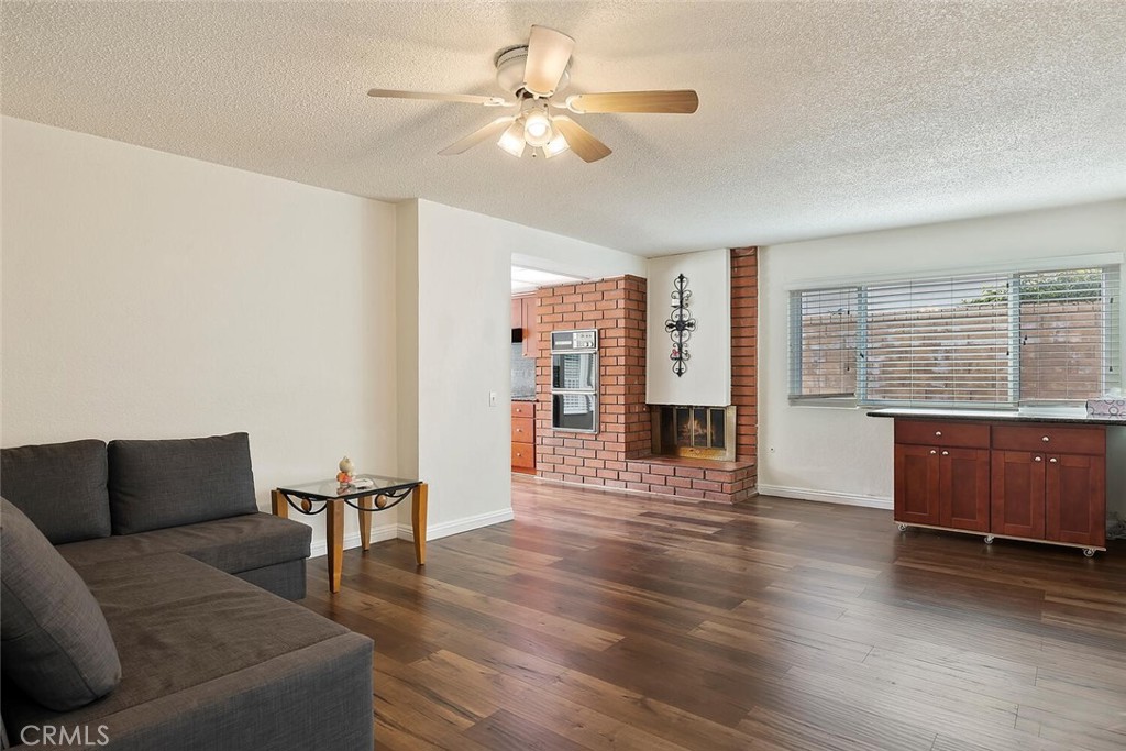 23850 Vía Jacara Valencia, CA 91355 - Photo 11 of 41 a living room with furniture and wooden floor