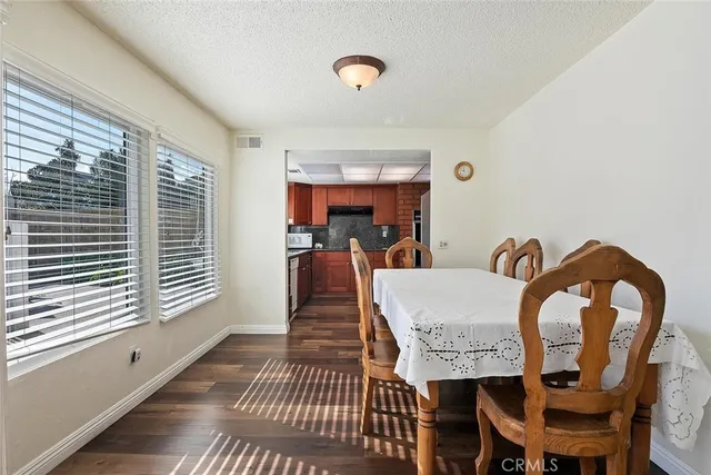 a view of a dining room with furniture and window