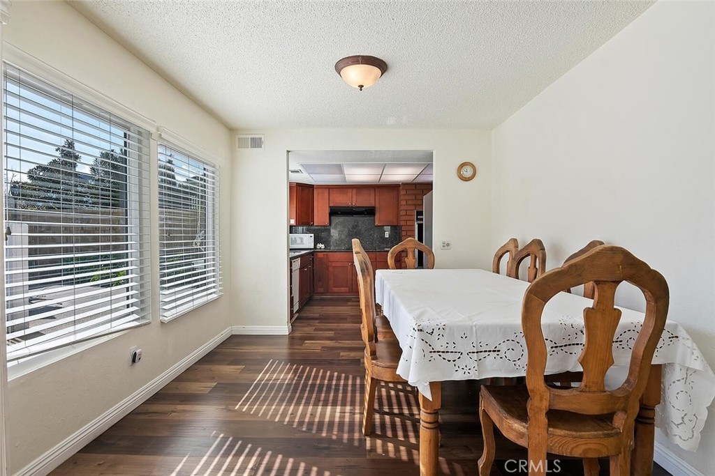 23850 Vía Jacara Valencia, CA 91355 - Photo 16 of 41 a view of a dining room with furniture and window