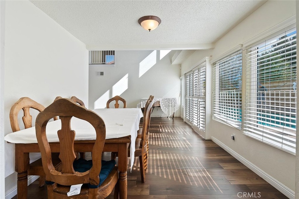23850 Vía Jacara Valencia, CA 91355 - Photo 17 of 41 a dining room with furniture and window