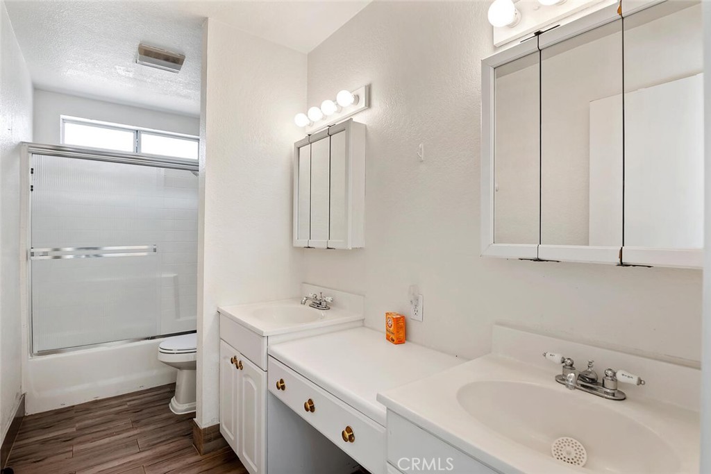 23850 Vía Jacara Valencia, CA 91355 - Photo 24 of 41 a bathroom with a sink a toilet and shower
