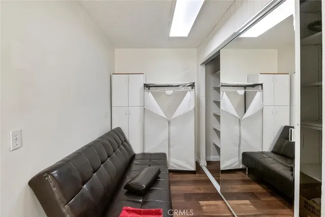 a living room with a couch and a rug