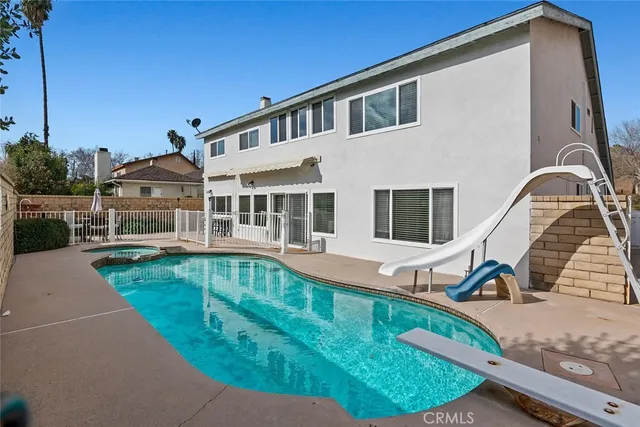 a front view of a house with swimming pool