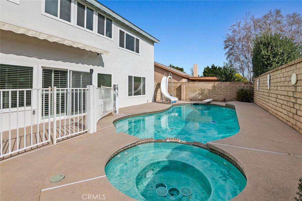 23850 Vía Jacara Valencia, CA 91355 - Photo 33 of 41 a view of a house with a backyard