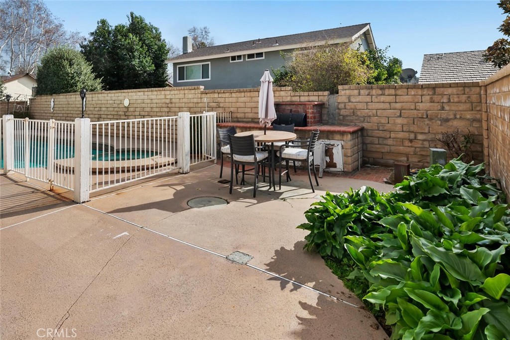 23850 Vía Jacara Valencia, CA 91355 - Photo 36 of 41 a view of a patio with a table and chairs