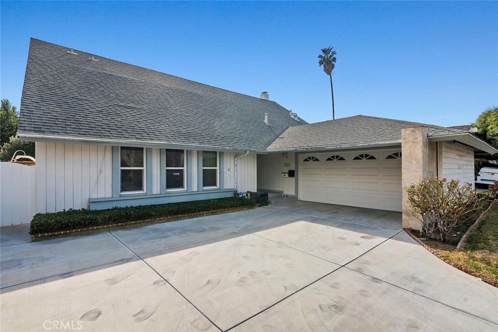 23850 Vía Jacara Valencia, CA 91355 - Photo 39 of 41 a front view of a house with a garden