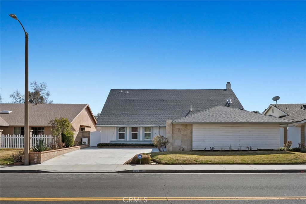 23850 Vía Jacara Valencia, CA 91355 - Photo 4 of 41 a front view of a house with a garden