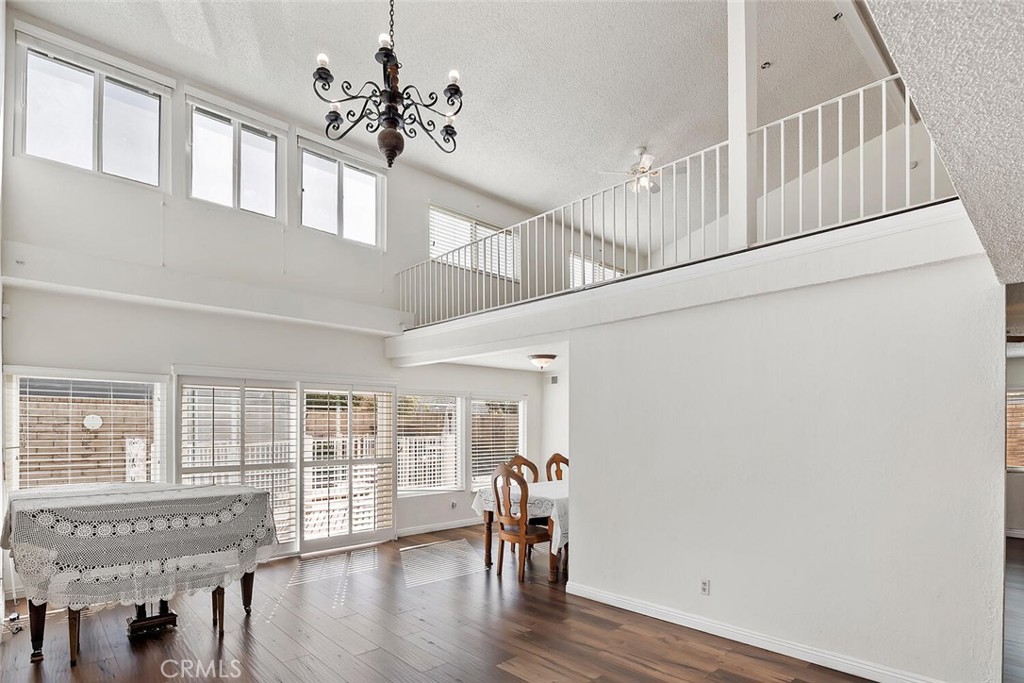 23850 Vía Jacara Valencia, CA 91355 - Photo 5 of 41 a view of entryway and hall with wooden floor