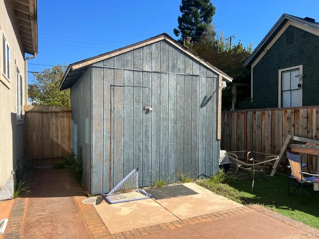 a backyard of a house with seating space