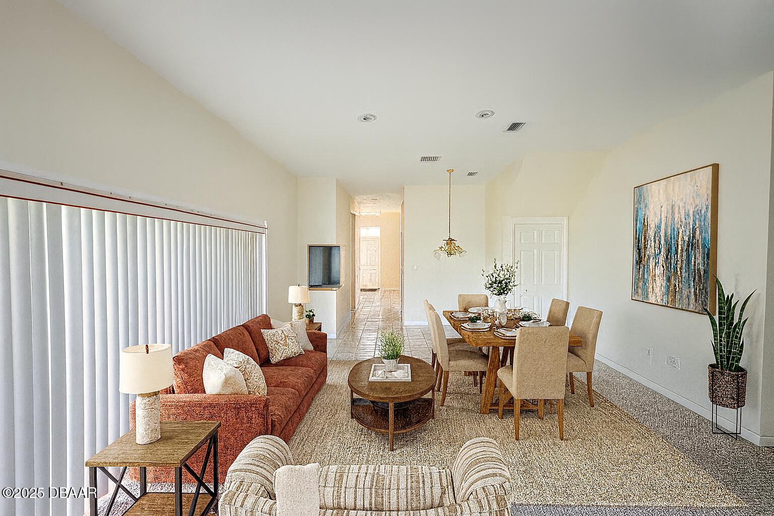 126 Carriage Ponce Inlet, FL 32127 - Photo 12 of 20 a living room with furniture and a large window