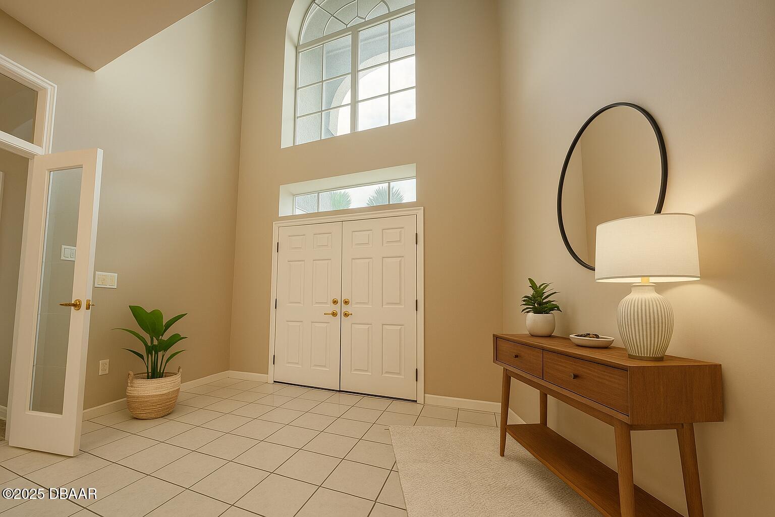 126 Carriage Ponce Inlet, FL 32127 - Photo 4 of 20 a living room with a table and a potted plant