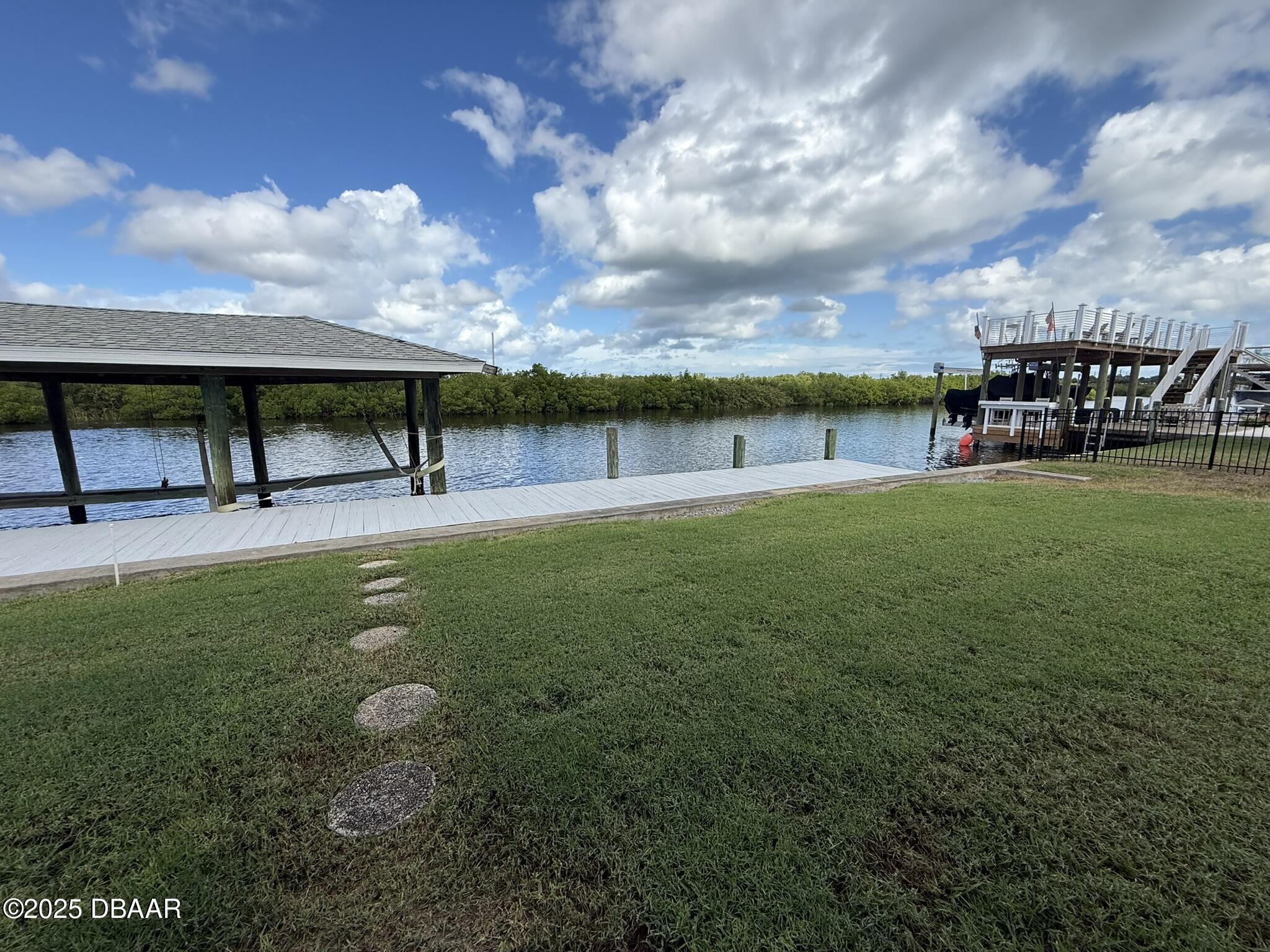 126 Carriage Ponce Inlet, FL 32127 - Photo 8 of 20 a view of a swimming pool with an outdoor space and porch
