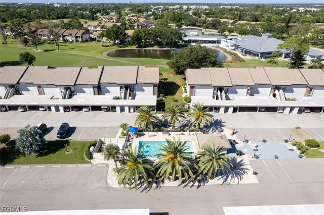 an aerial view of a house with a lake view