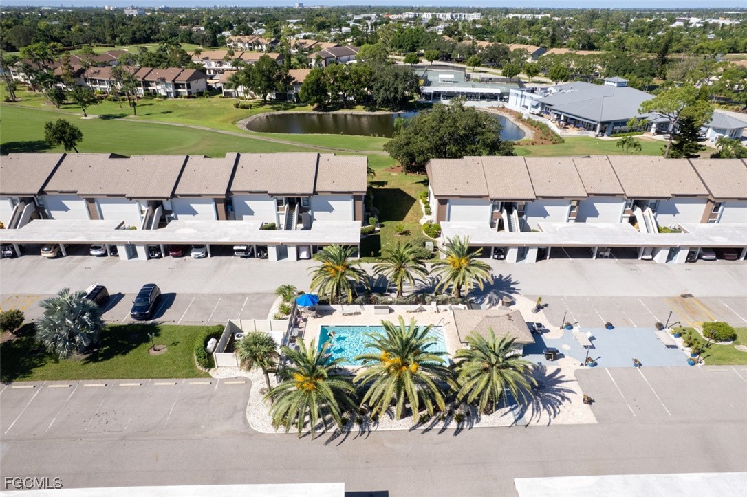 5710 Trailwinds Drive, Unit 525 Fort Myers, FL 33907 - Photo 2 of 37 an aerial view of a house with a lake view