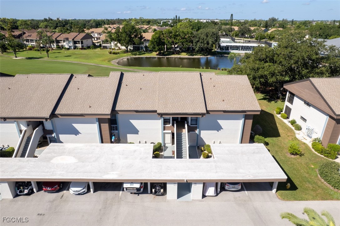 5710 Trailwinds Drive, Unit 525 Fort Myers, FL 33907 - Photo 30 of 37 an aerial view of a house with a yard basket ball court and outdoor seating