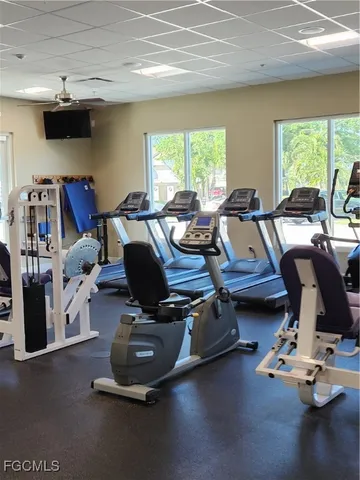 a room with gym equipment and a large window