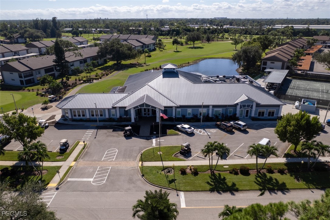 5710 Trailwinds Drive, Unit 525 Fort Myers, FL 33907 - Photo 36 of 37 an aerial view of a house with a garden and lake view
