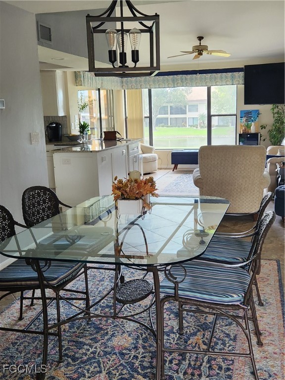 5710 Trailwinds Drive, Unit 525 Fort Myers, FL 33907 - Photo 7 of 37 a view of a dining room with furniture window and outside view