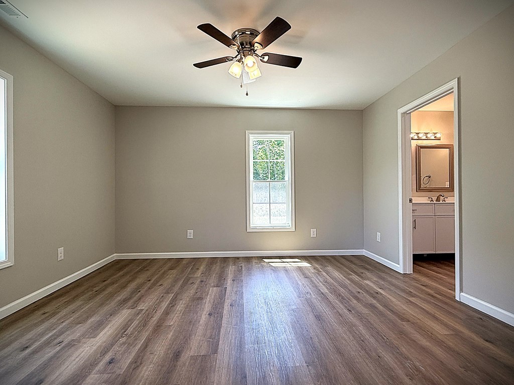 246 Ralph Spivey Lane Gainesboro, TN 38562 - Photo 22 of 53 a view of an empty room with window and wooden floor
