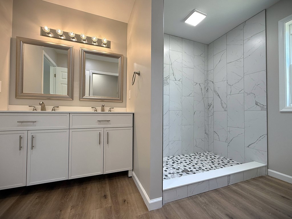 246 Ralph Spivey Lane Gainesboro, TN 38562 - Photo 29 of 53 a bathroom with a double vanity sink mirror and shower
