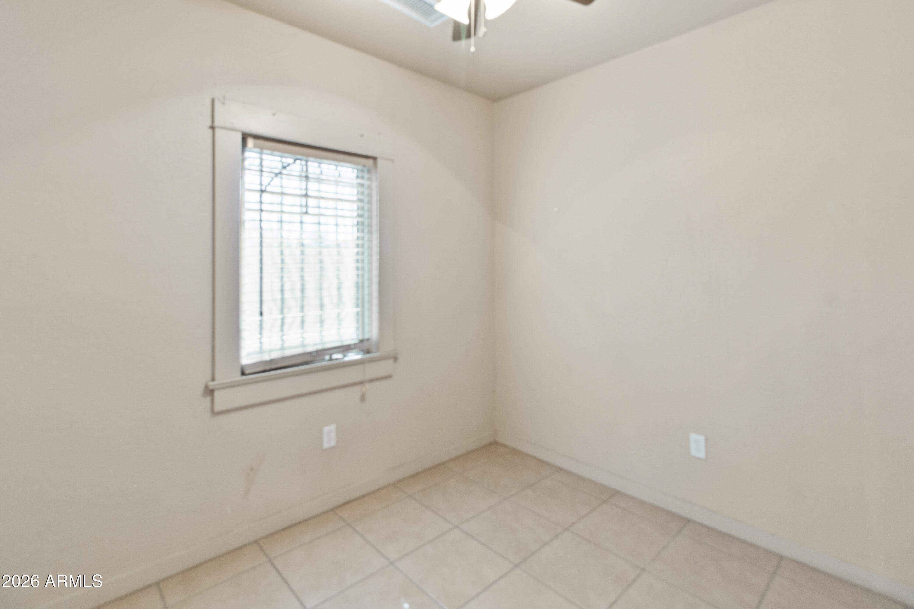 1237 East Pierce Street Phoenix, AZ 85006 - Photo 15 of 23 an empty room with a window