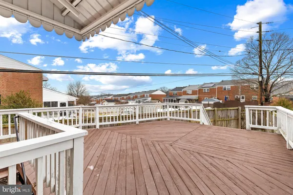 a view of a balcony with wooden floor