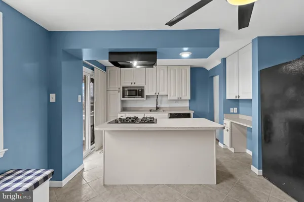 a kitchen with stainless steel appliances a refrigerator and a stove