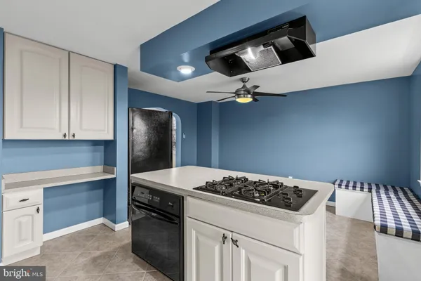 a kitchen that has a stove and a microwave