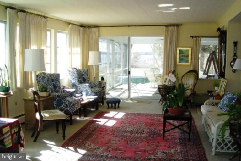 7286 Bozman Neavitt Road Bozman, MD 21612 - Photo 7 of 12 Waterside great room opens to screened porch