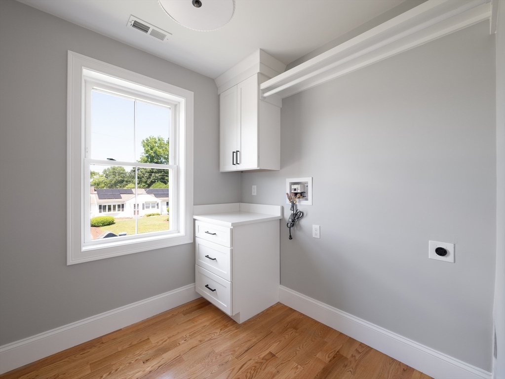 5 Stanley Street Natick, MA 01760 - Photo 12 of 21 a room with a window and wooden floor