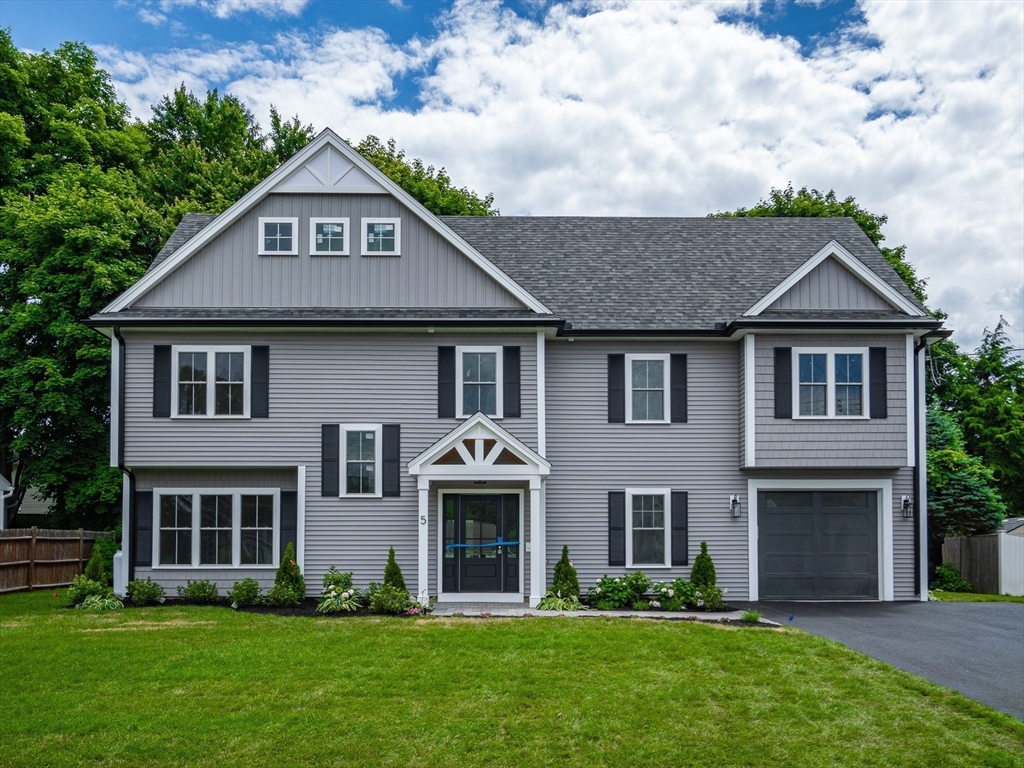 5 Stanley Street Natick, MA 01760 - Photo 21 of 21 a front view of a house with a yard and trees