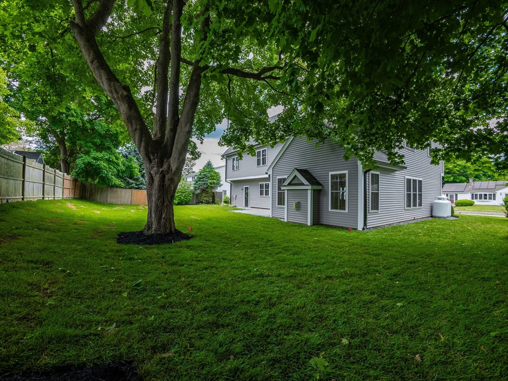 5 Stanley Street Natick, MA 01760 - Photo 3 of 21 a front view of a house with garden