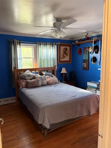 a bedroom that has a bed and a table in it